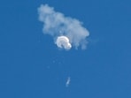 The suspected Chinese spy balloon drifts to the ocean after being shot down off the coast in Surfside Beach, South Carolina, US February 4, 2023.  