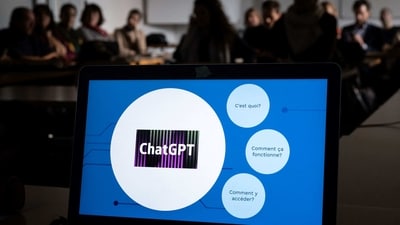 Teachers are seen behind a laptop during a workshop on ChatGpt bot organised for by the School Media Service (SEM) of the Public education of the Swiss canton of Geneva, on February 1, 2023. (Photo by Fabrice COFFRINI / AFP) (AFP) Teachers are seen behind a laptop during a workshop on ChatGpt bot organised for by the School Media Service (SEM) of the Public education of the Swiss canton of Geneva, on February 1, 2023. (Photo by Fabrice COFFRINI / AFP) (AFP)