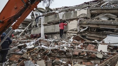 A man searches for people in the rubble of a destroyed building in Gaziantep, Turkey, Monday, Feb. 6, 2023. (AP) A man searches for people in the rubble of a destroyed building in Gaziantep, Turkey, Monday, Feb. 6, 2023. (AP)
