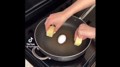 The image, taken from the viral Twitter video, shows an egg placed in the middle of a pan. (Screengrab)