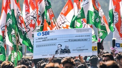 Indian Youth Congress activists protest over the impact on LIC and SBI investors due to Adani row, at Jantar Mantar in New Delhi on Monday (PTI) Indian Youth Congress activists protest over the impact on LIC and SBI investors due to Adani row, at Jantar Mantar in New Delhi on Monday (PTI)