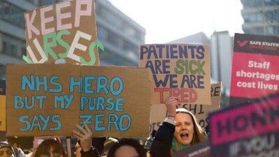Nurses protest during a strike by NHS medical workers, amid a dispute with the government over pay, outside St Thomas' Hospital, in London, Britain, February 6, 2023 (Reuters)