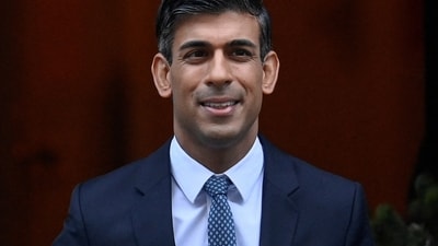 Rishi Sunak: British Prime Minister Rishi Sunak walks outside Downing Street. (Reuters)