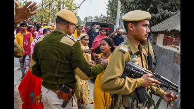 Morigaon: A policeman speaks with relatives of people arrested by police for their alleged involvement in child marriages, during Assam government's statewide crackdown on child marriages, outside Mayong police station in Morigaon district, Saturday, Feb. 4, 2023. (PTI Photo)(PTI02_04_2023_000141A) (PTI)
