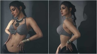 A messy braided ponytail with a few loose strands of hair sculpting Mouni's face gave the finishing touch to the star's vintage photoshoot. (Instagram) A messy braided ponytail with a few loose strands of hair sculpting Mouni's face gave the finishing touch to the star's vintage photoshoot. (Instagram)
