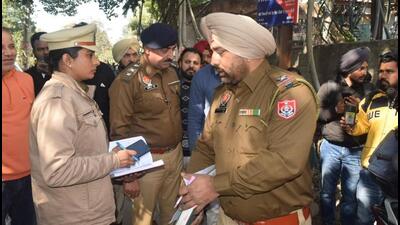 Punjab Police personnel outside the Ludhiana district court complex after the firing in which one person was injured on Tuesday. (Gurpreet Singh/HT)