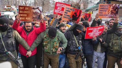 Security personnel try to stop workers of the PDP taking out a protest march against the J&K administration’s anti-encroachment drive, in Srinagar on Tuesday. (PTI) Security personnel try to stop workers of the PDP taking out a protest march against the J&K administration’s anti-encroachment drive, in Srinagar on Tuesday. (PTI)