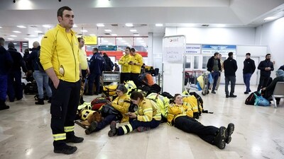 Rescuers from the aid organization ‘@fire’ arrive at the Adana Sakirpasa Airport in Turkey on Tuesday.&nbsp; (REUTERS)