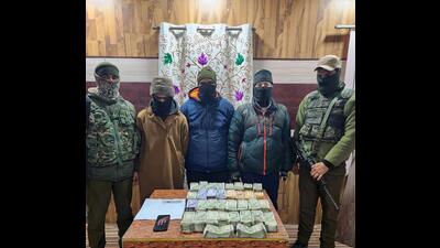 The arrested LeT terror associates and money recovered from them in Srinagar on Tuesday. (ANI) The arrested LeT terror associates and money recovered from them in Srinagar on Tuesday. (ANI)