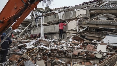 A man searches for people in the rubble of a destroyed building in Gaziantep, Turkey, Monday, Feb. 6, 2023. (AP) A man searches for people in the rubble of a destroyed building in Gaziantep, Turkey, Monday, Feb. 6, 2023. (AP)