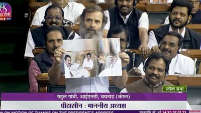 Congress leader Rahul Gandhi showing old photo of Gautam Adani with then Gujarat chief minister Narendra Modi.