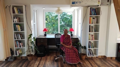 Lakshmi sits at her farm stay. (Photo by: Kiruba Shankar)