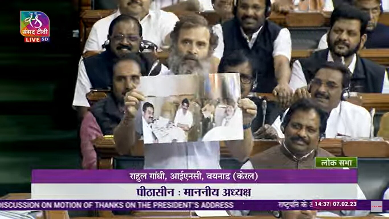 Rahul Gandhi shows a photo of Gautam Adani with PM Modi on a plane while speaking in Lok Sabha.