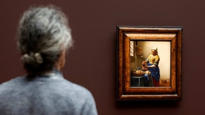 A man looks at Vermeer's painting “The Milkmaid” at the Rijksmuseum in Amsterdam, on February 6. Vermeer earned the nickname “The Sphinx of Delft” because so little was known about him — he left behind no letters or diaries and there are no known portraits of him. But recent research has begun to unravel the mysteries of the painter. (Piroschka van de Wouw / REUTERS) A man looks at Vermeer's painting “The Milkmaid” at the Rijksmuseum in Amsterdam, on February 6. Vermeer earned the nickname “The Sphinx of Delft” because so little was known about him — he left behind no letters or diaries and there are no known portraits of him. But recent research has begun to unravel the mysteries of the painter. (Piroschka van de Wouw / REUTERS)
