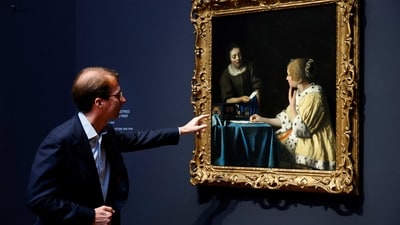 Rijksmuseum General Director Taco Dibbits, seen here in front of the painting “Mistress and Maid”, believes the exhibition provides a chance for visitors to immerse themselves in the exquisite interior scenes for which Vermeer is best known. “Vermeer has this quality of kind of everything is perfect. Everything falls in place," Dibbits said. "There’s perfect happiness in his scenes. There’s tranquility, there’s intimacy.” (Piroschka van de Wouw / REUTERS) Rijksmuseum General Director Taco Dibbits, seen here in front of the painting “Mistress and Maid”, believes the exhibition provides a chance for visitors to immerse themselves in the exquisite interior scenes for which Vermeer is best known. “Vermeer has this quality of kind of everything is perfect. Everything falls in place," Dibbits said. "There’s perfect happiness in his scenes. There’s tranquility, there’s intimacy.” (Piroschka van de Wouw / REUTERS)