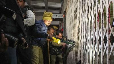Forest department officials try to tranquilise the leopard after cornering it in the stairwell on the ground floor of the court complex. (PTI) Forest department officials try to tranquilise the leopard after cornering it in the stairwell on the ground floor of the court complex. (PTI)