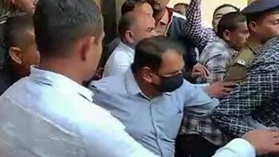 Jaysukh Patel (centre) of Oreva Group after he surrendered before the sessions court in Morbi on January 30. (ANI photo)