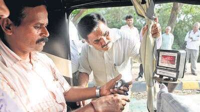 Mumbai, India - July 3, 2015 : Inspectors of Legal Metrology Department during recalibration of meters of auto rickshaws at BKC in Mumbai, India, on Friday, July 3, 2015. (Photo by Pratham Gokhale/ Hindustan Times) (Hindustan Times)