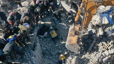 This aerial view shows rescuers searching for survivors amidst the rubble of a collapsed building in the town of Harim in Syria's rebel-held noryhwestern Idlib province on the border with Turkey, (AFP) This aerial view shows rescuers searching for survivors amidst the rubble of a collapsed building in the town of Harim in Syria's rebel-held noryhwestern Idlib province on the border with Turkey, (AFP)