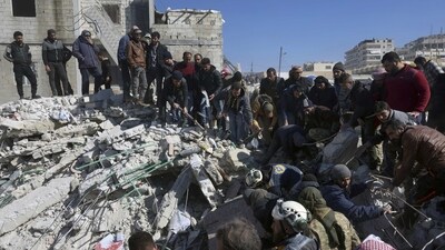 Rescuers and residents search through the rubble of collapsed buildings in the town of Harem near the Turkish border, Idlib province, Syria, Wednesday, Feb. 8, 2023. With the hope of finding survivors fading, stretched rescue teams in Turkey and Syria searched Wednesday for signs of life in the rubble of thousands of buildings toppled by a catastrophic earthquake. (AP Photo/Ghaith Alsayed) (AP) Rescuers and residents search through the rubble of collapsed buildings in the town of Harem near the Turkish border, Idlib province, Syria, Wednesday, Feb. 8, 2023. With the hope of finding survivors fading, stretched rescue teams in Turkey and Syria searched Wednesday for signs of life in the rubble of thousands of buildings toppled by a catastrophic earthquake. (AP Photo/Ghaith Alsayed) (AP)