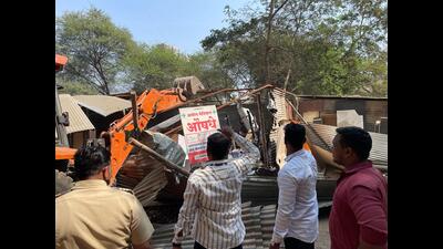 The incident took place on Spicer Shagvi road in Aundh on Tuesday at around 1:00 pm during an anti-encroachment drive in Aundh. (HT PHOTO)
