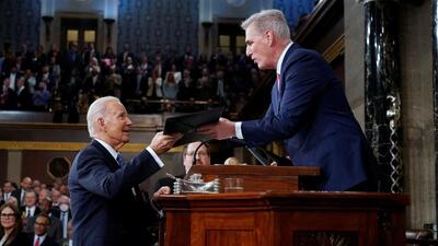 US President Joe Biden (left) hands a copy of his speech to House Speaker Kevin McCarthy of California, before he delivers his State of the Union address to a joint session of Congress, at the Capitol in Washington, US, on Tuesday. (REUTERS) US President Joe Biden (left) hands a copy of his speech to House Speaker Kevin McCarthy of California, before he delivers his State of the Union address to a joint session of Congress, at the Capitol in Washington, US, on Tuesday. (REUTERS)