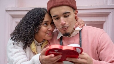 Chocolate Day 2023: The image shows a couple enjoying chocolates. (Representational Image/ Pexels (Budgeron Bach)) Chocolate Day 2023: The image shows a couple enjoying chocolates. (Representational Image/ Pexels (Budgeron Bach))