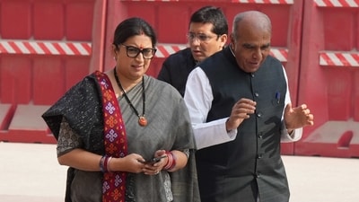 Union minister Smriti Irani with BJP MP Jagdambika Pal during the Winter Session of Parliament, in New Delhi. (PTI file)