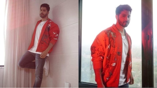 His rockstar look in a funky red jacket, faded jeans and white T-shirt is a perfect winter date look. (Instagram/@varundvn) His rockstar look in a funky red jacket, faded jeans and white T-shirt is a perfect winter date look. (Instagram/@varundvn)