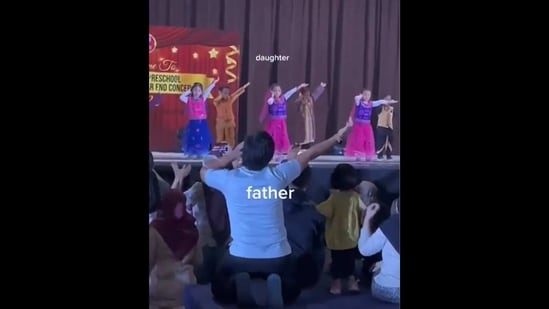 The image, taken from the video, shows the dad performing the entire dance routine with other kids. (Twitter/@ipskabra)