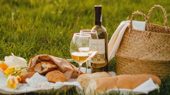 Picnic in the Park: Pack a basket with food, drinks, and a blanket, and head to a local park for a picnic. Try to find a spot with a nice view, and enjoy each other's company over a meal.(Kateryna Hliznitsova on Unsplash)