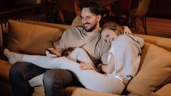 Movie Night at Home: Rent a movie or stream one online, make some popcorn, and have a cozy night in. Snuggle up on the couch, and enjoy a relaxing evening together.(Pexels )