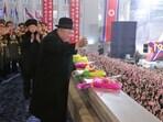 North Korea Kim Jong Un: North Korean leader Kim Jong Un greets the crowd during a military parade.