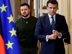 France's President Emmanuel Macron and Ukraine's President Volodymyr Zelensky arrive for a joint press conference with Germany's Chancellor in Paris on Wednesday. (AFP) France's President Emmanuel Macron and Ukraine's President Volodymyr Zelensky arrive for a joint press conference with Germany's Chancellor in Paris on Wednesday. (AFP)