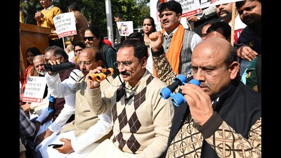 Delhi BJP working president Virendra Sachdeva with other party leaders at a protest against chief minister Arvind Kejriwal’s government at Shahidi Park in New Delhi on Thursday. (Raj K Raj/HT Photo) Delhi BJP working president Virendra Sachdeva with other party leaders at a protest against chief minister Arvind Kejriwal’s government at Shahidi Park in New Delhi on Thursday. (Raj K Raj/HT Photo)