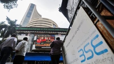 People stand outside the Bombay Stock Exchange (BSE). (REUTERS)