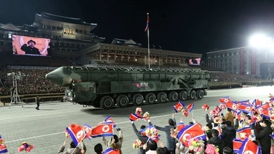A missile is displayed as North Korean leader Kim Jong Un is seen on large screens during a military parade to mark the 75th founding anniversary of North Korea's army, (via REUTERS)