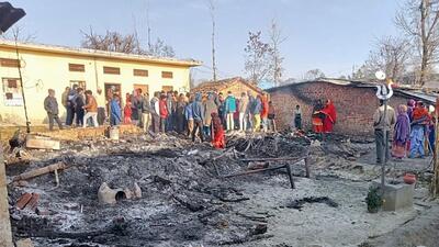 People gather at the site where the four children were burnt alive when a fire broke out in two shanties at Bane-Di-Hatti village in Gagret town of Una district, on Thursday. (HT Photo)