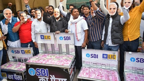 Congress supporters stage a protest over the Adani-Hindenburg issue at the party headquarters, in New Delhi. (Rahul Singh)