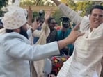 Akshay Kumar and Mohanlal dancing at a wedding. Akshay Kumar and Mohanlal dancing at a wedding.