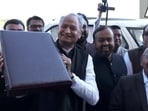 Rajasthan chief minister Ashok Gehlot with the Budget briefcase outside Rajasthan Assembly.(Twitter/ANI)