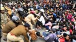 Police personnel detain protestors during the demonstration. (ANI)