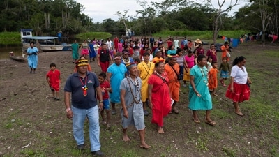 Members of the Siekopai tribe seen at the representation of the union of families during the second binational meeting of the Siekopai Nation community in the Amazon region in Lagartococha, Peru, on January 10. Displaced by decades of war as well as commercial and cultural intrusions, the Siekopai eke out a living doing odd jobs in rural towns bordered by oil fields, palm plantations, and a network of busy roads. (Pedro Pardo / AFP) Members of the Siekopai tribe seen at the representation of the union of families during the second binational meeting of the Siekopai Nation community in the Amazon region in Lagartococha, Peru, on January 10. Displaced by decades of war as well as commercial and cultural intrusions, the Siekopai eke out a living doing odd jobs in rural towns bordered by oil fields, palm plantations, and a network of busy roads. (Pedro Pardo / AFP)