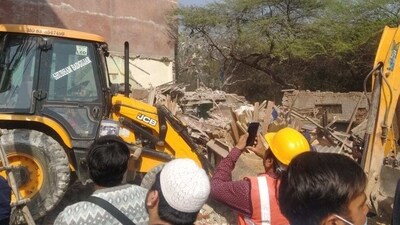 The drive started in Friday morning in the presence of police personnel and the authority has been demolishing two and three-storeyed buildings. (ANI) The drive started in Friday morning in the presence of police personnel and the authority has been demolishing two and three-storeyed buildings. (ANI)
