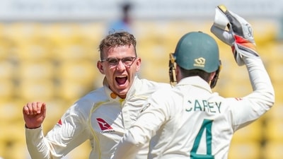 Australia's Todd Murphy, left, along with his teammate Alex Carey celebrate dismissal of India's Virat Kohli (AP) Australia's Todd Murphy, left, along with his teammate Alex Carey celebrate dismissal of India's Virat Kohli (AP)