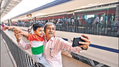 Mumbai, India - February 10, 2023: Railway employee Sahebrao Kadam along with his grandson Vedhraj clicks a selfie with Vande Bharat Express train in the background before travelling to Solapur in the same train during the inauguration of two Vande Bharat Express trains to Solapur and Shirdi, Santacruz Chembur Link Road Extension bridge and Kurar underpass by PM Narendra Modi, at Chhatrapati Shivaji Maharaj Terminus in Mumbai, India, on Friday, February 10, 2023. (Photo by Anshuman Poyrekar/Hindustan Times) (Anshuman Poyrekar/HT PHOTO) Mumbai, India - February 10, 2023: Railway employee Sahebrao Kadam along with his grandson Vedhraj clicks a selfie with Vande Bharat Express train in the background before travelling to Solapur in the same train during the inauguration of two Vande Bharat Express trains to Solapur and Shirdi, Santacruz Chembur Link Road Extension bridge and Kurar underpass by PM Narendra Modi, at Chhatrapati Shivaji Maharaj Terminus in Mumbai, India, on Friday, February 10, 2023. (Photo by Anshuman Poyrekar/Hindustan Times) (Anshuman Poyrekar/HT PHOTO)