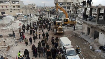An ambulance waits to evacuate victims, as search and rescue operations continue days after a deadly earthquake hit Turkey and Syria, in the town of Jindayris, in the rebel-held part of Aleppo province, on February 10, 2023. - The 7.8-magnitude quake early on February 6 has killed more than 20,000 people in Turkey and war-ravaged Syria, according to officials and medics in the two countries, flattening entire neighbourhoods. (Photo by Rami al SAYED / AFP) (AFP)