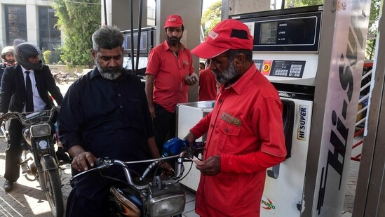 People at a gasoline station in Pakistan's port city of Karachi. (AFP)