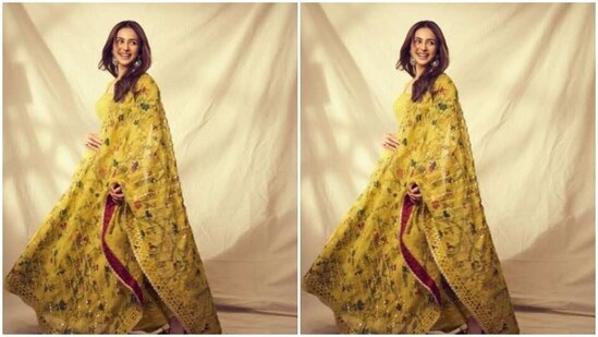 Rakul Preet decked up in a stunning mossy yellow anarkali salwar featuring full sleeves, a round neckline and golden minimal embellishment details. The salwar also came imprinted with pretty bird motifs in multiple colours.&nbsp;(Instagram/@rakulpreet)