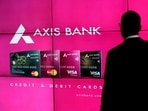 A visitor watches an Axis Bank's advertisement at its corporate headquarters in Mumbai.